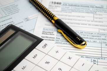 Naklejka na ściany i meble Tax forms, spread sheet with pen and calculator.
