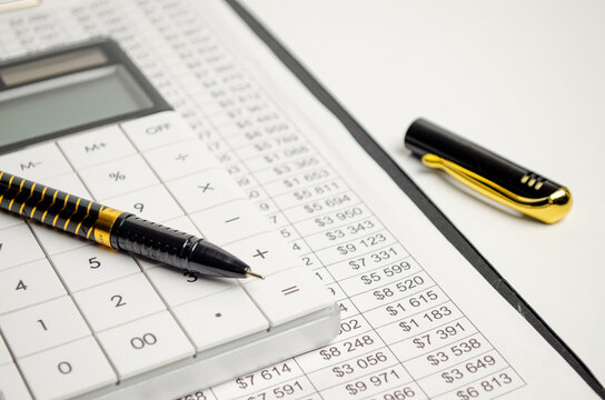 Tax Forms, Spread Sheet With Pen And Calculator.