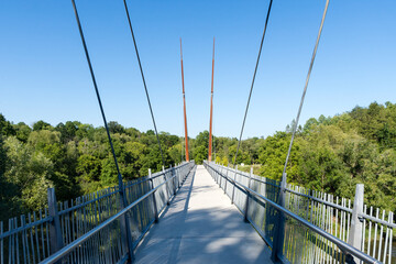 Suspended pedestrian bridge in Milne Dam Conservation Park, Markham, Ontario, Canada