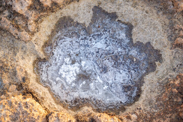 Remains of salt when seawater evaporates in rocks, a mineral rich in sodium.