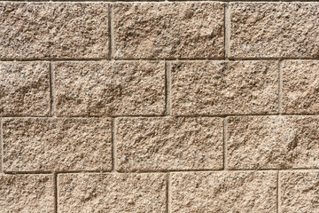 Clouse up of textured beige cinder block wall