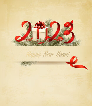 Happy New Year and Christmas holiday background with a 2022 and branch of tree and gift box. Vector.