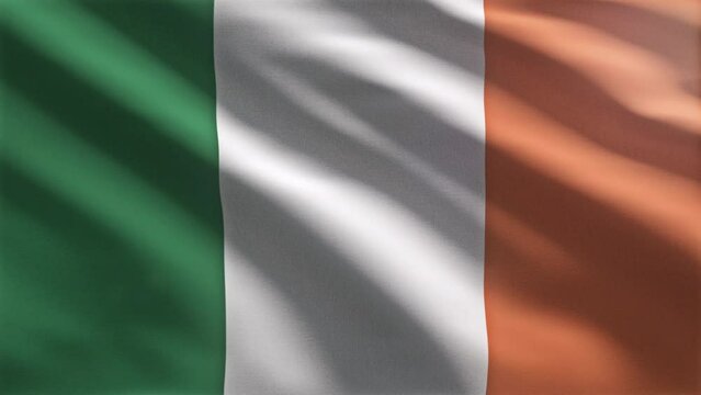 Fluttering the national flag of the european Republic of Ireland. National flag of Ireland with green white and orange vertical stripes. National tricolour flag of Ireland. Ensign. Dublin.