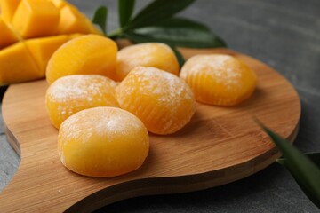 Delicious mango mochi on wooden board, closeup