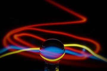 Glass ball light painting creating abstract pattern
