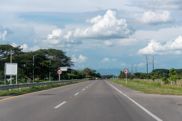 Rural highway with speed limit signs. Colombia .