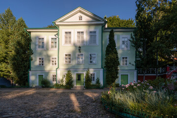 Obraz premium View of the Abbot's House in the Holy Dormition Pskov-Pechersk Monastery on a sunny summer day, Pechory, Pskov region, Russia