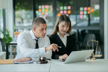 Lawyers sit for a meeting with the team at the law firm.