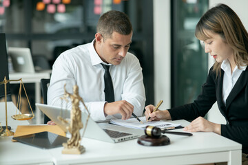 Lawyers sit for a meeting with the team at the law firm.