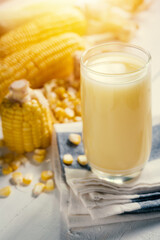 Yellow Sweet corn drink on wood  background , Yellow Corn juice, sweet corn milk, healthy organic food, bio nutrition