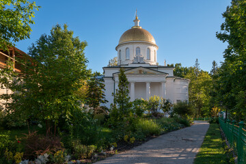 View of the St. Michael's Cathedral of the Holy Dormition Pskov-Pechersk Monastery on a sunny summer day, Pechora, Pskov region, Russia