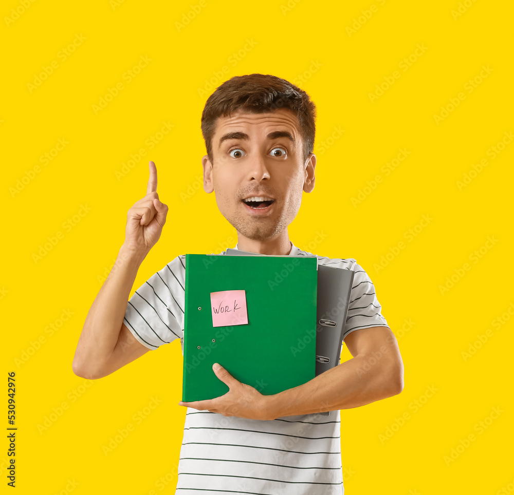 Poster funny office worker with big head holding folders on yellow background