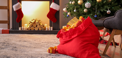 Santa bag full of gifts in living room