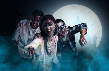 Scary zombies outdoors at night of full moon