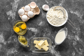 Frame made of different ingredients for baking on dark background