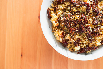 healthy plant-based food, vegan moroccan couscous with lentils and sundried tomatoes