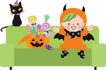 悪魔の仮装をした赤ちゃんの子と沢山のお菓子