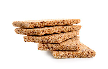 Stack of tasty sesame kozinaki on white background
