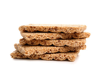 Stack of tasty sesame kozinaki on white background