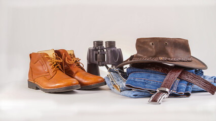 Leather shoes, leather hats, leather belts, jeans, binoculars, hiking clothes.
