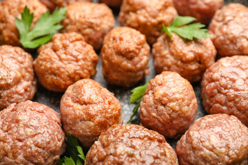 Tasty meat balls with parsley on frying pan, closeup