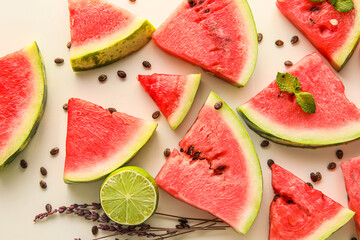 Slices of watermelon, lime, mint, flowers and seeds on white background