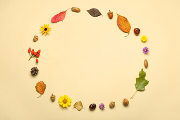 Frame made of natural forest decor and flowers on color background