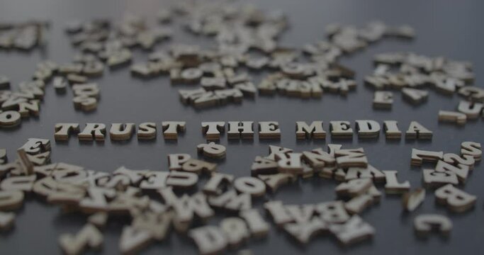 trust the media title blown to pieces, fake news narrative opposition protest distrust.