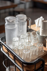Drinking water bottle with glasses in cafe table