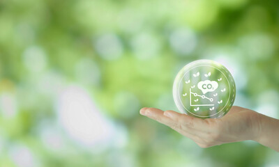 Reduction of carbon emissions, carbon neutral concept. Net zero greenhouse gas emissions target. Reducing carbon footprint concept. Decreasing CO2 emissions target symbol on green view background.