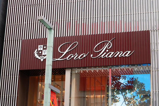 TOKYO, JAPAN - June 22, 2021: The sign on a Loro Piana store with a screen below it in Tokyo's Ginza area.
