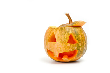 A pumpkin lantern, a Halloween attribute resembling a head with a frightening or funny face, shot against a white background.