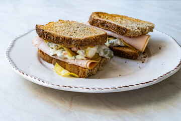 Light Sandwich with Smoked Turkey Breast and Russian Salad.