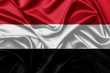 Yemen waving national flag close up satin texture background