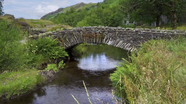 Watendlath's attractive stone, packhorse bridge sitting over the Watendlath beck, this is the source for Lodore Falls – a tourist attraction from Victorian times.