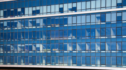 Windows of modern glass office building. Concept of modern architecture from glass, steel and concrete. Architectural detail © evgenij84