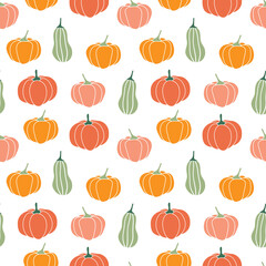 Seamless pattern with pumpkins of different shapes and colors. Autumn print for the Halloween holiday. Vector graphics.