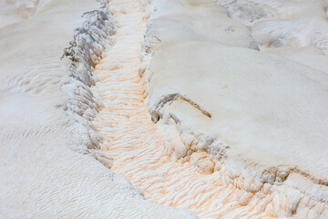 Stream in white volcanic rock.