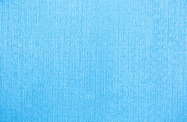 Blue background of decorative plaster with abstract spots. Unusual texture of this wall with beautiful patterns, creative surface background. Finishing coating for building cladding.