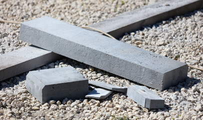 Concrete curb lie at the construction site.