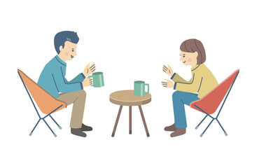 椅子に座って会話を楽しむ男女