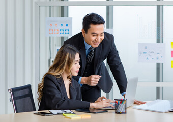 Millennial Asian successful professional male businessman mentor in formal suit coaching training...