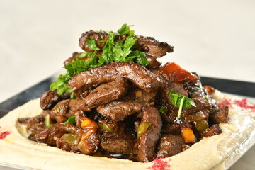 beef liver, served dry or with curry in a bowl, karahi or plate
