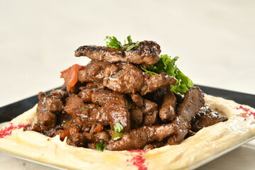 beef liver, served dry or with curry in a bowl, karahi or plate
