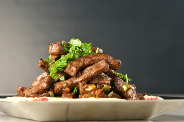 beef liver, served dry or with curry in a bowl, karahi or plate
