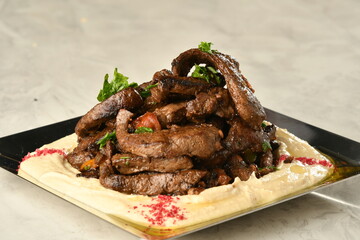 beef liver, served dry or with curry in a bowl, karahi or plate
