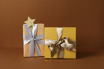 Concept of gift, gift boxes on brown background