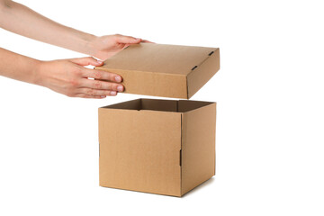 Female hands hold lid of box, and box isolated on white background