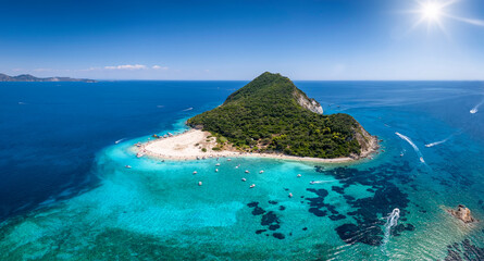The beautiful island of Marathonisi or Turtle island in the bay of Laganas with turquoise sea and...