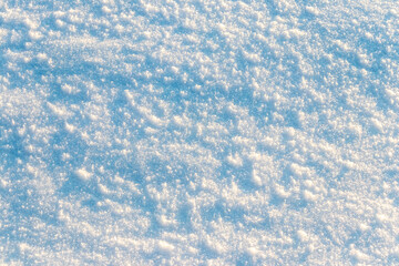 Obraz premium Texture of snow in sunny weather. Snow cover with snow crystals